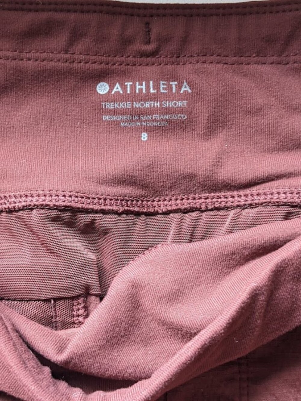 Athleta Trekkie North nylon hiking shorts size 8 rust mahogany color
